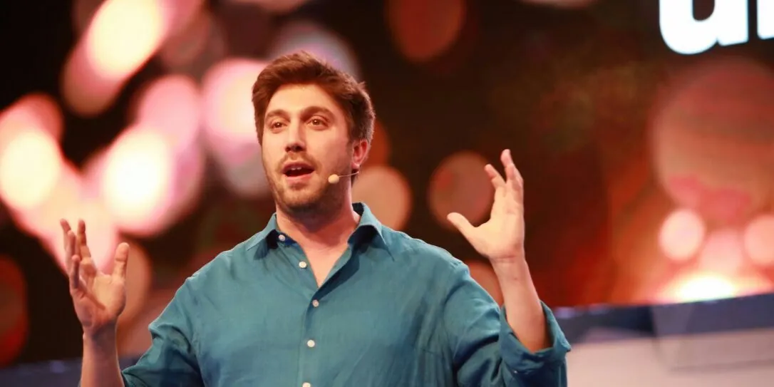 Daniel Seal speaking on stage