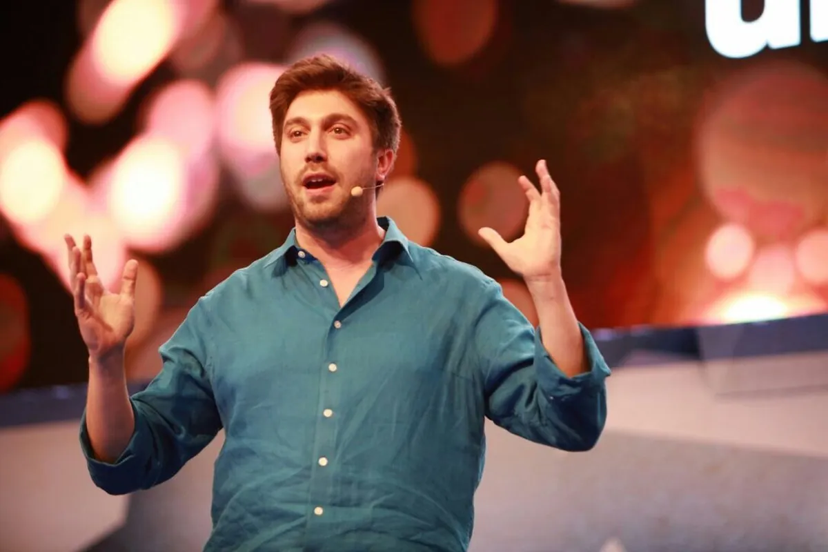 Daniel Seal speaking on stage