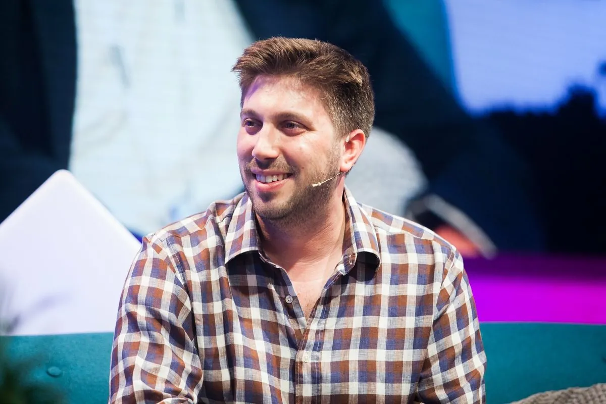 Daniel Seal smiling during a panel discussion